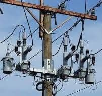 Reclosing devices mounted on a utility pole